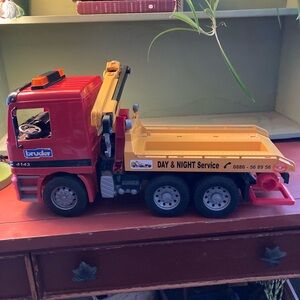 Bruder tow truck 
Gently used